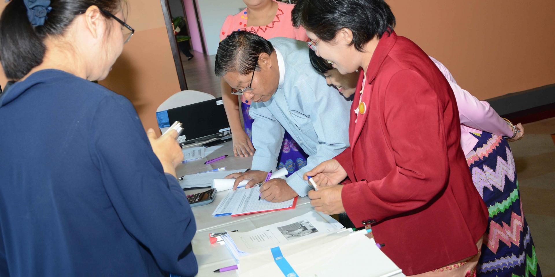Government health officials arrive for the opening session of the final batch of training in Yangon. Photo: UNOPS Arrival of government health officials to the opening session for the final batch of training in Yangon. Photo: UNOPS