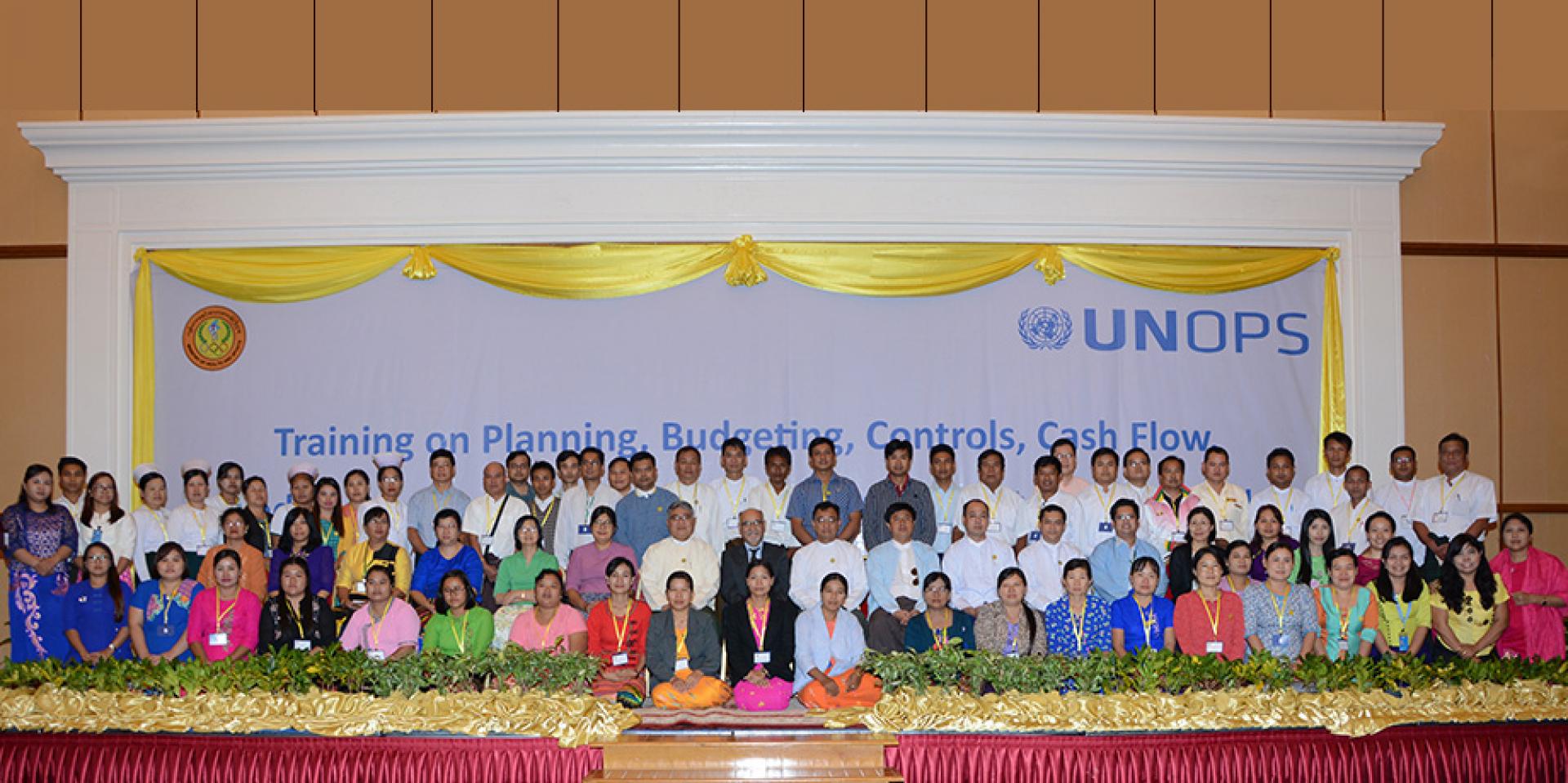 Dr Thar Tun Kyaw, Director General, DOPH, MOHS, with officials from the Ministry of Health and Sports, UNOPS and participating government health staff from across the country, after the opening session of the first batch of training, Nay Pyi Taw, 23 October 2017.