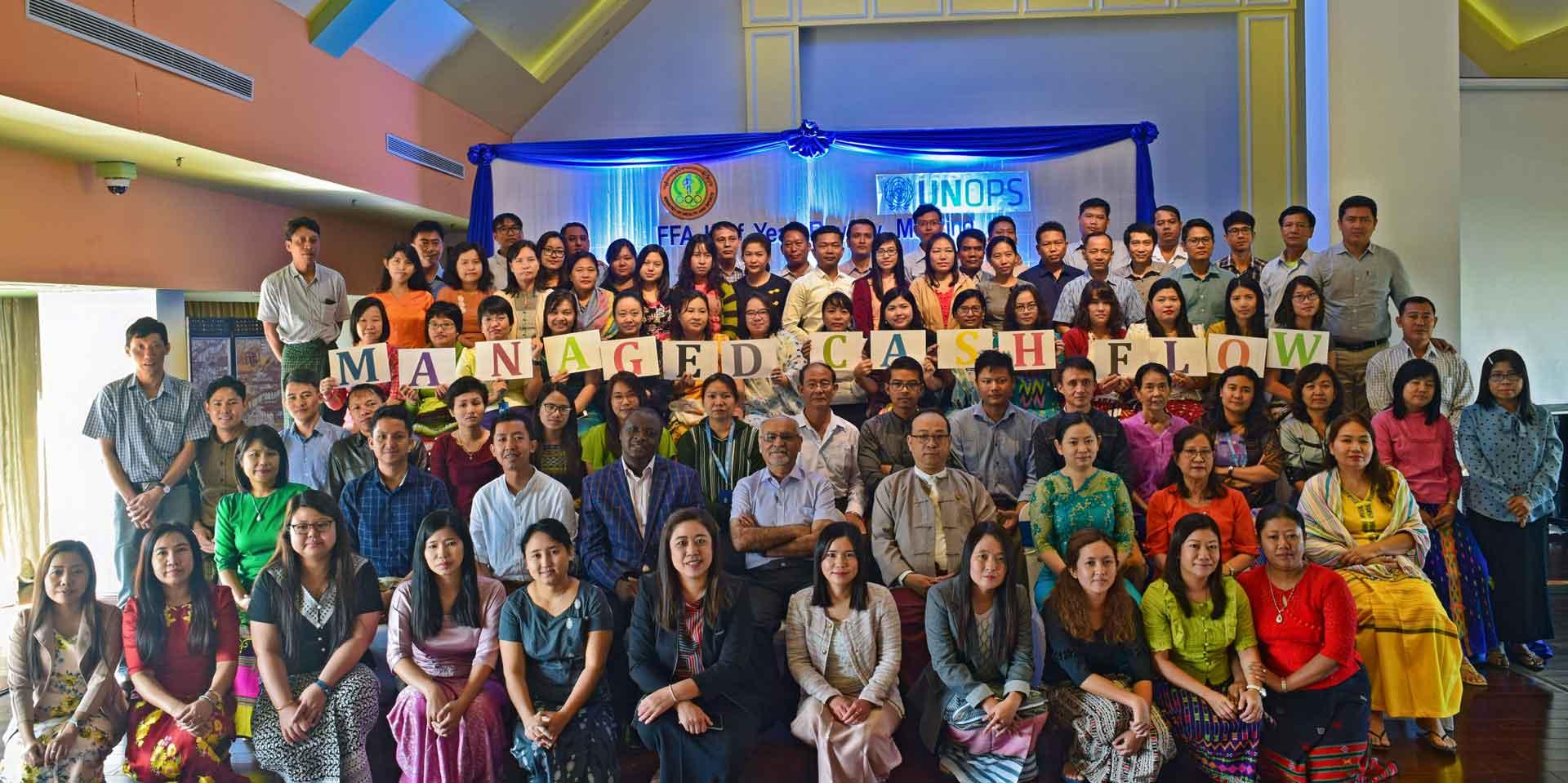 Dr Zaw Myint, Regional Officer and Senior Consultant TB Specialist, National TB Programme, MOHS, and Dr Faisal Mansoor, Head of Programme, Dan Magambo, Financial Management Specialist, UNOPS-PR, together with UNOPS-PR Field Finance Assistants at the half-yearly review meeting in Yangon.    Photo: UNOPS