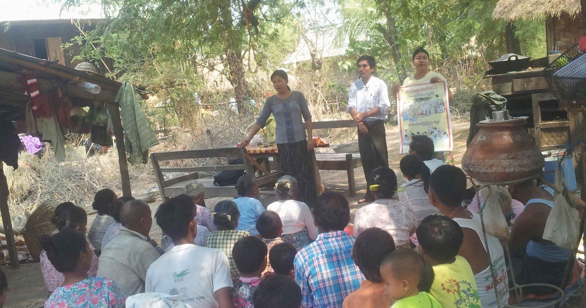 MHAA Myithar Project Community Facilitator U Kyaw Tint gives a TB health education talk to villagers at Thotan village in Myithar Township together with Community TB Volunteer, Daw Myint Myint San. Photo: MHAA