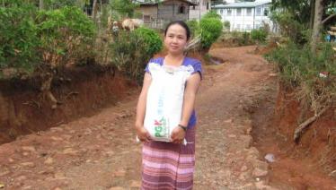 A caregiver from Pyi Gyi Khin’s HIV/AIDS project is on her way to a beneficiary’s home as part of the Community Home Based Care and Support activity with support from the Global Fund. Lwai Hat village, Aung Ban Township, Southern Shan State. Photo: UNOPS