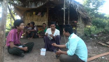 During a visit to Ko Win Zaw’s home, Ko Nay Linn checks anti-TB medicines to confirm he is taking the correct doses. Incorrect doses could delay his recovery and give rise to drug resistance. Photo: MHAA