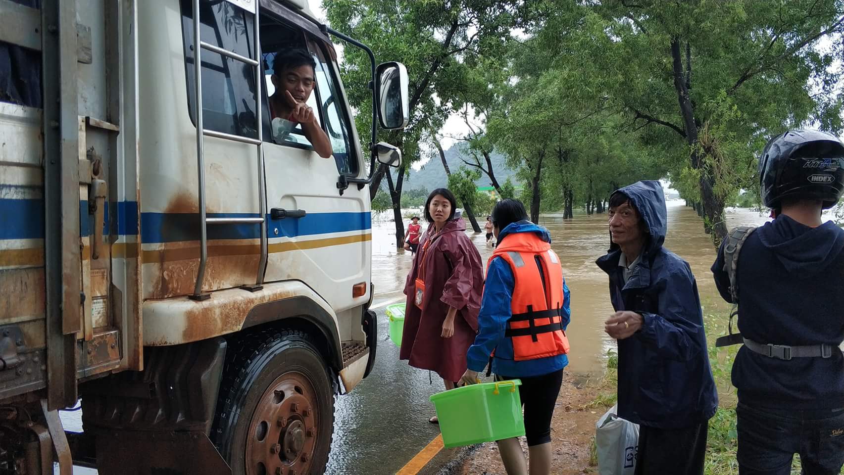 Staff and volunteers travelled by any means available to reach people affected by the floods in Hpa-An. Photo: Pyi Gyi Khin